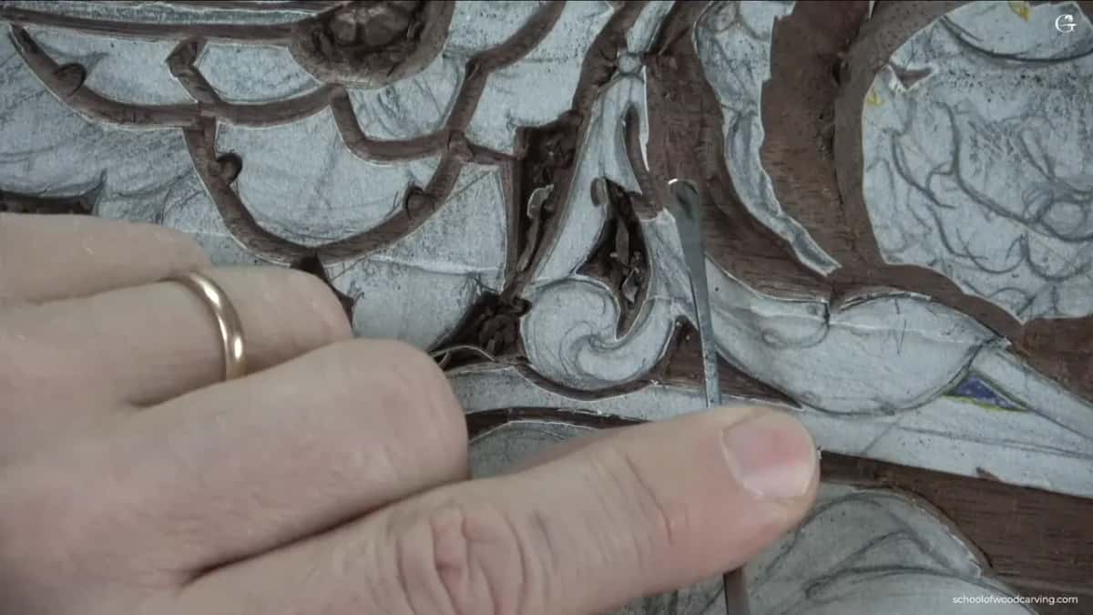 Close in on the fingers, one small edge working a chalked stem that is barely wider than the blade.