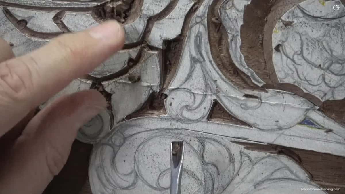 One finger points at a spot no wider than a pencil lead, which is where the whole operation happened.