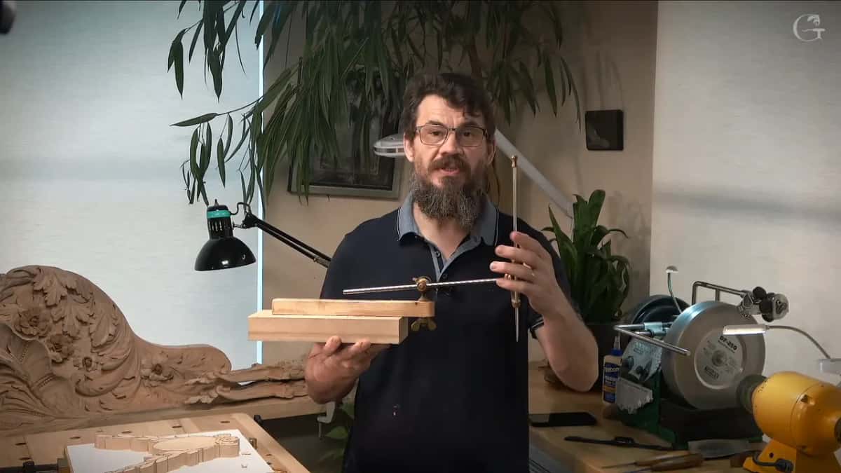 Alexander Grabovetskiy holding his pointing machine