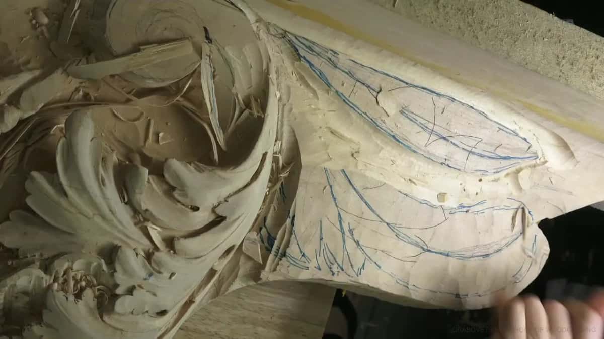 Blue marker lines map out two leaves beside a finished acanthus scroll.