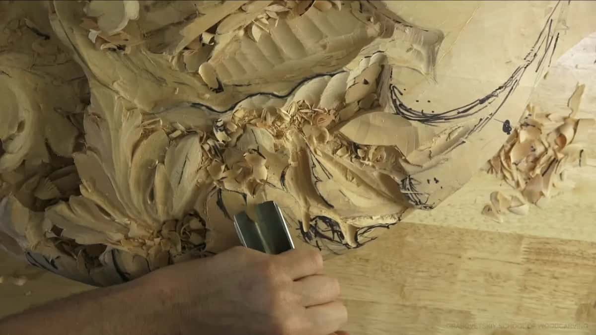 Wide gouge held in a fist, deep in the middle of the leaf.