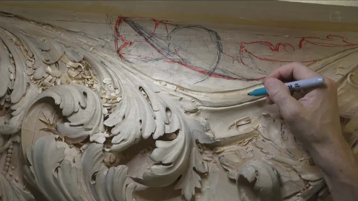 Blue marker in hand, over red and black lines.