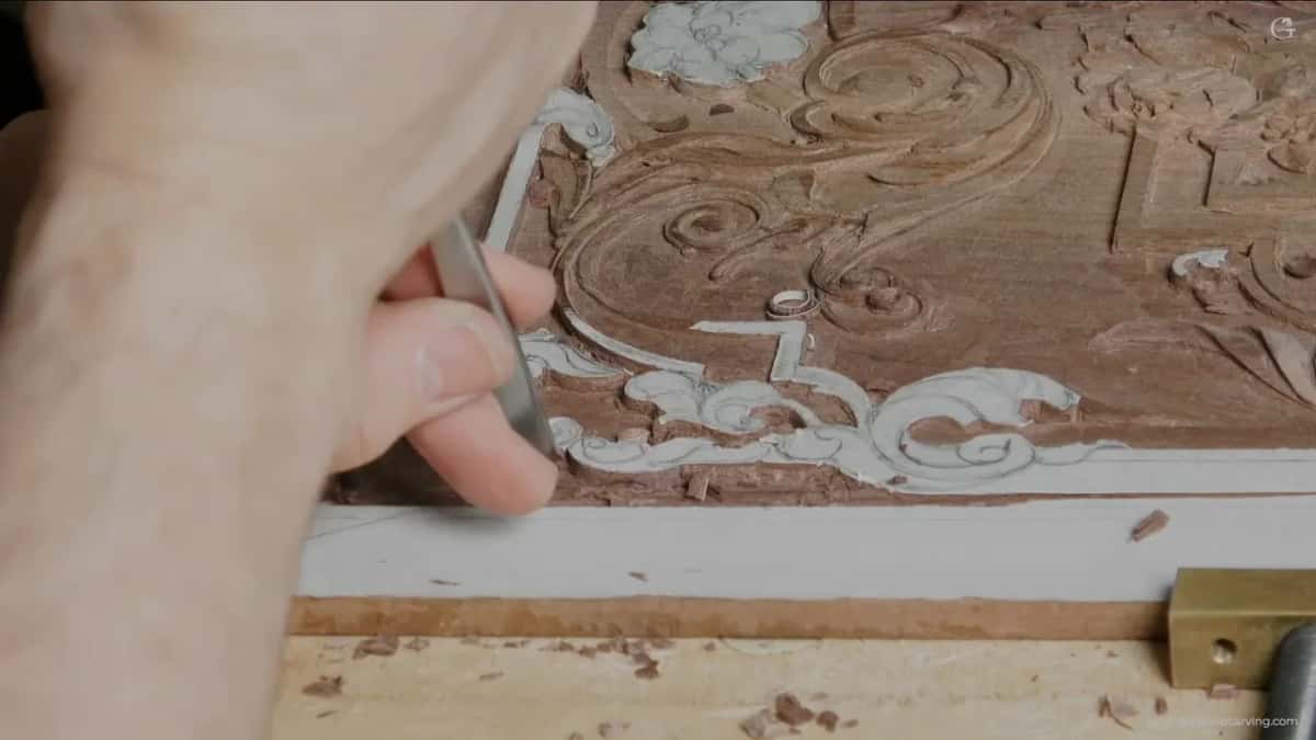 Narrow blade close in against the carved shape.