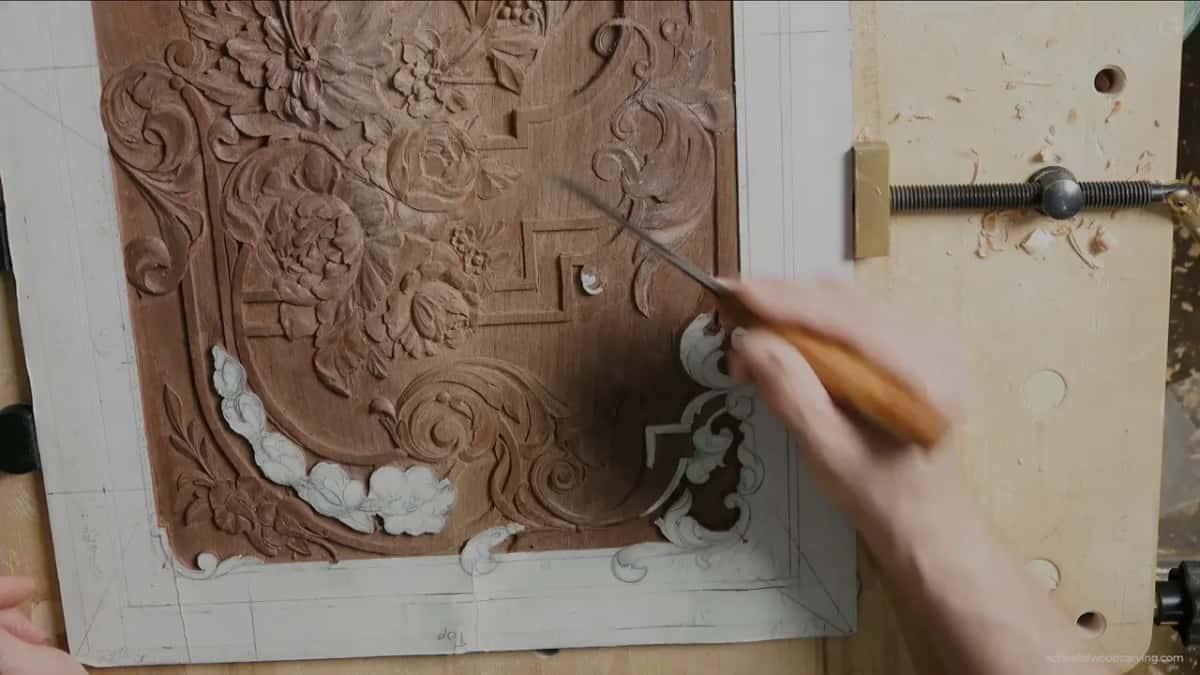 A gouge held over the scrolls while the level gets decided.