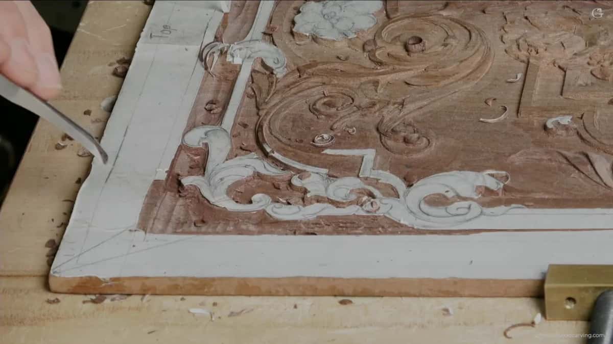 Gouge entering from the top left, barrel toward the ornament.
