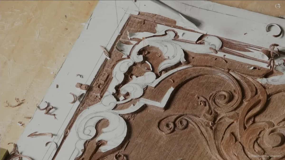 Corner ornament partway through, ground lowered round it.