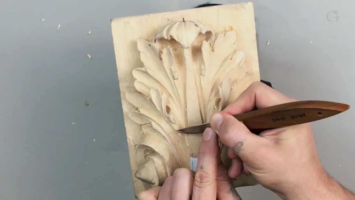Brown handled carving knife rounding over a ridge, nothing expensive about it