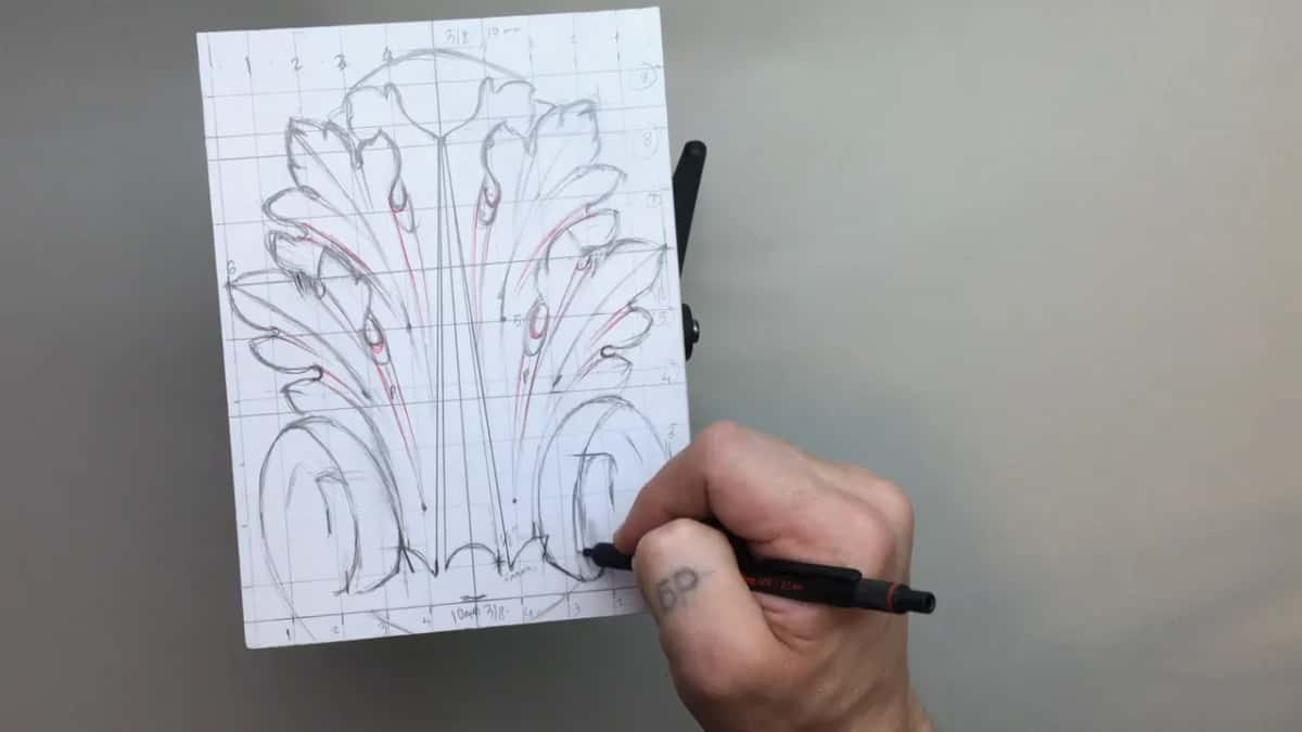 Pen working at the base volute, close to done