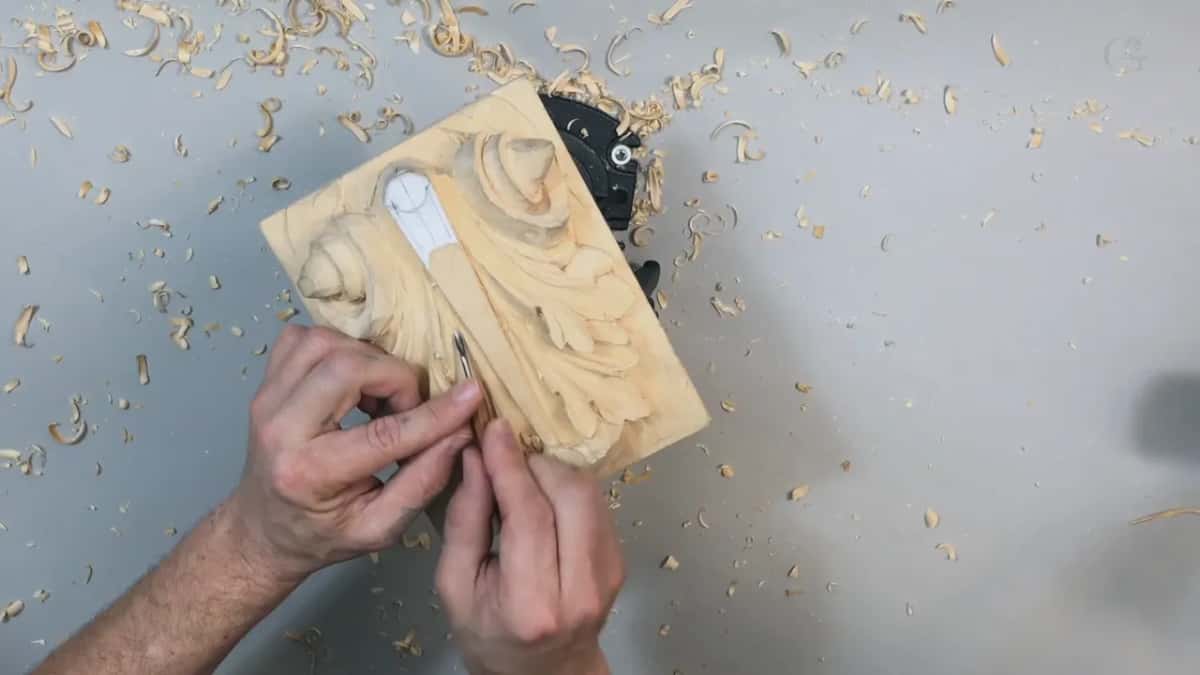 Bottom left, a small tool in both hands