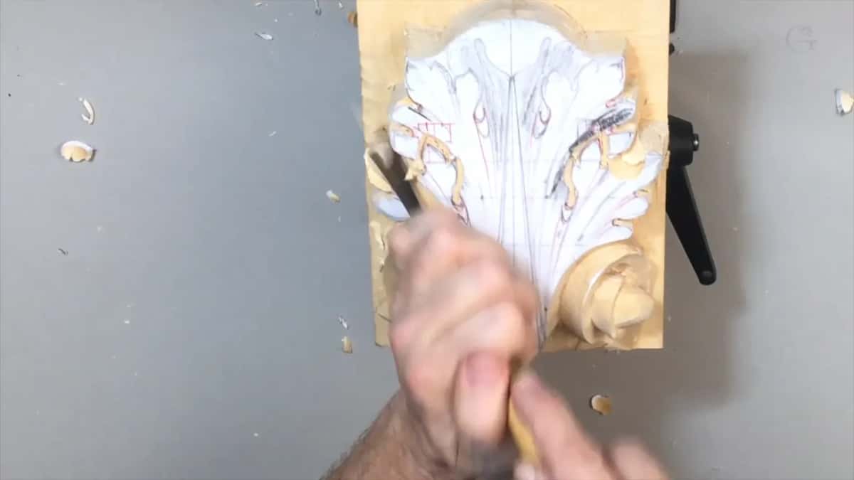 Hands blurred on a light handle, the blade working in the upper left lobes