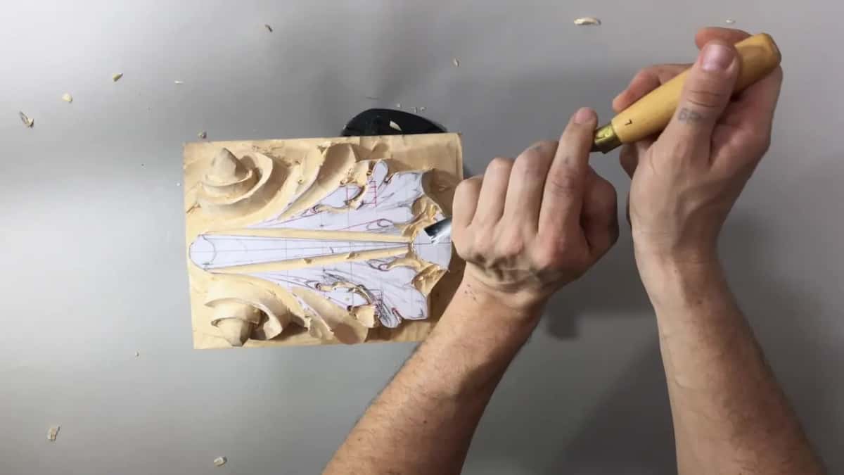 Pale handle with a brass ferrule, its blade at the right end of the sideways panel