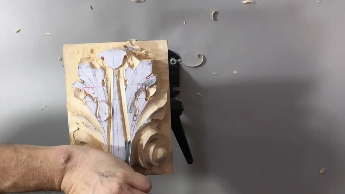 Blade at the foot of the center stem, a deep groove along its right side