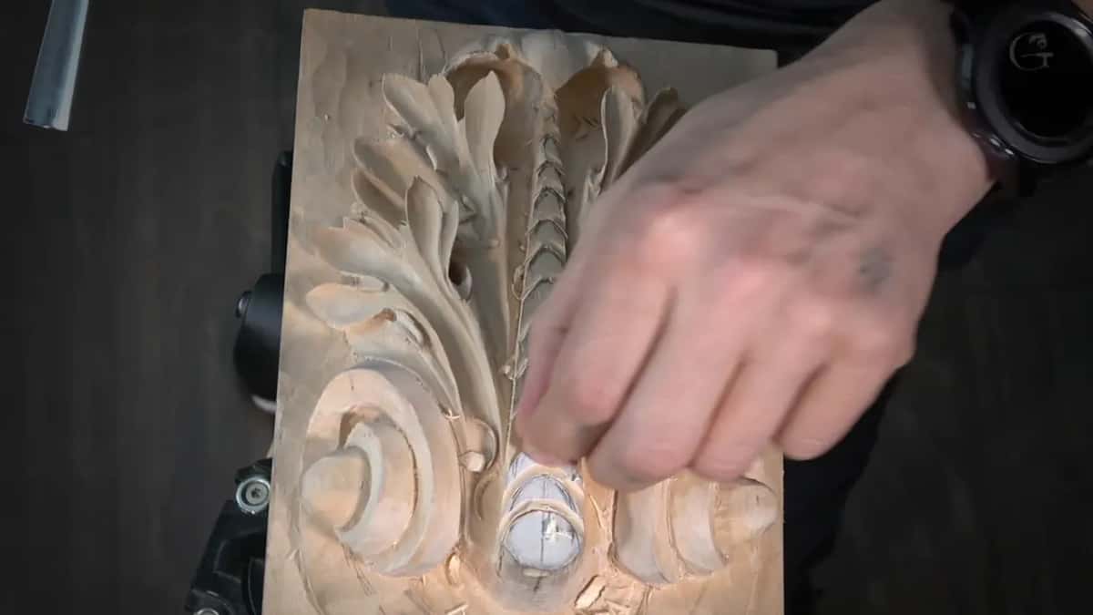 My hand slicing sideways with a small tool