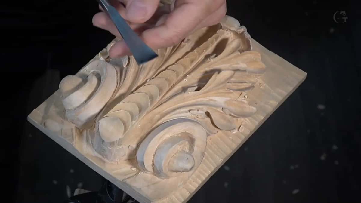 Chisel lying across the finished Roman leaf
