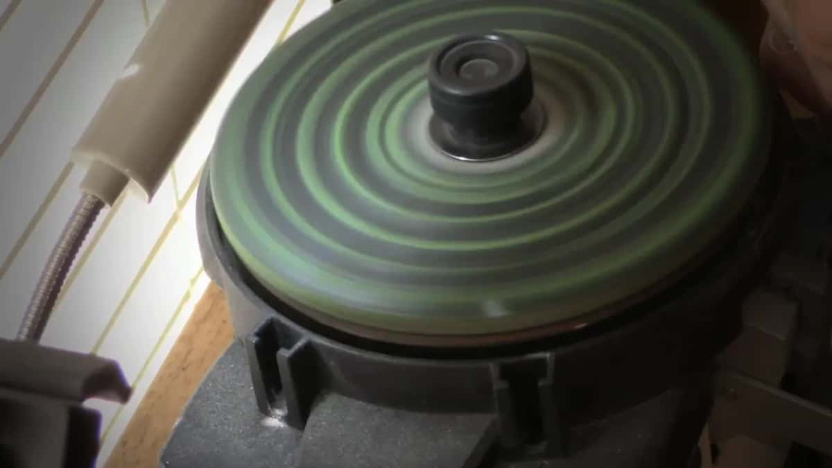 Buffing wheel gone black, which is steel coming off the edge