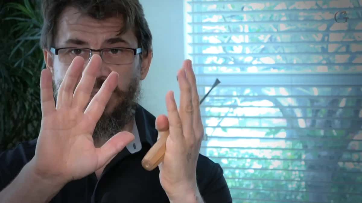 Both hands up, showing where skin oil darkens the wood as it oxidises