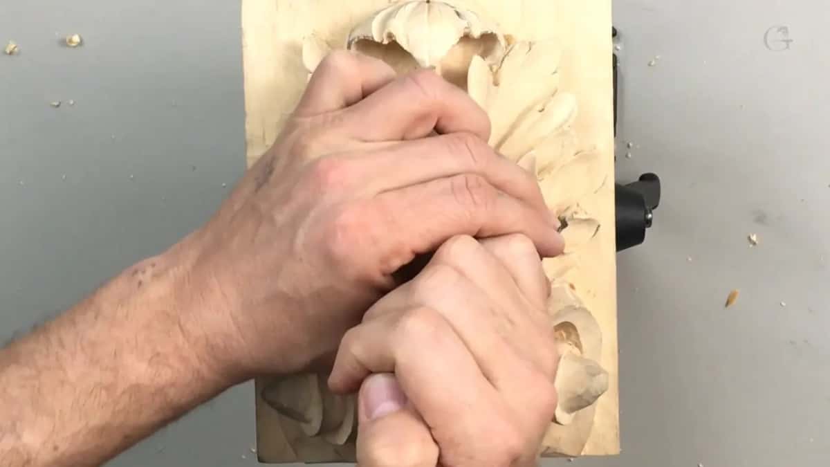 Hands clasped over the centre