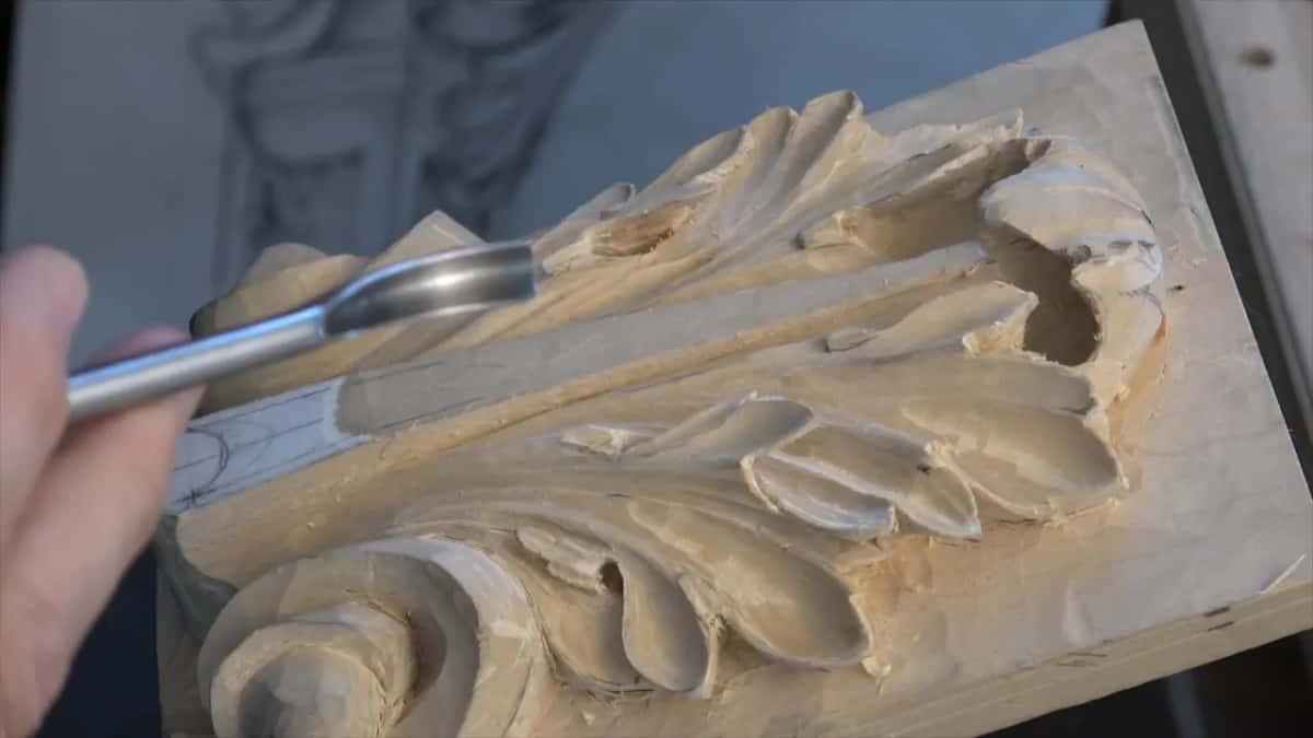Bright spoon arriving from the edge of frame and nothing else in it