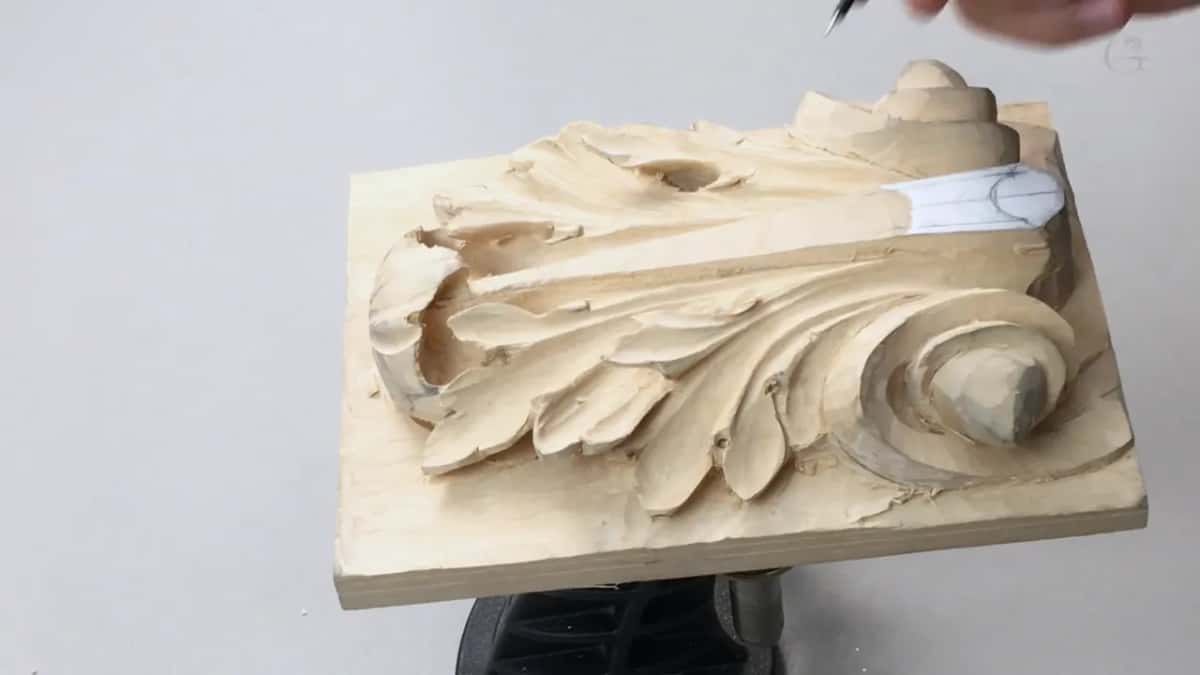 Pencil coming down from the upper right, board tipped away
