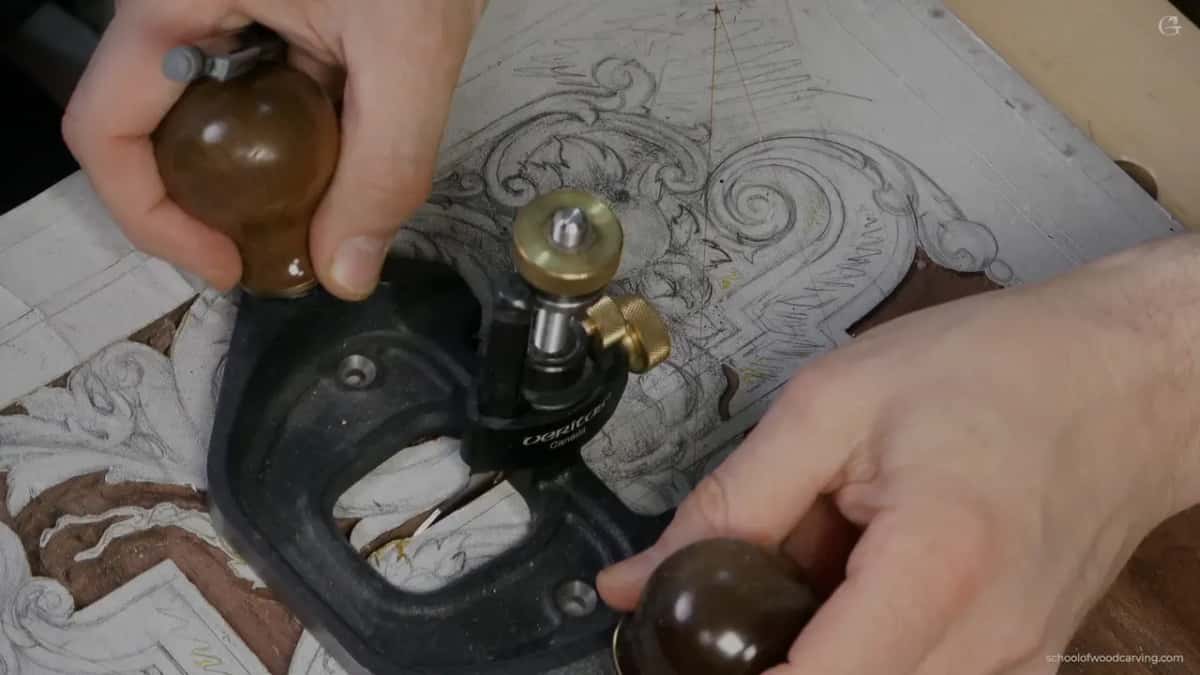 Both hands on the big plane, thumb against the brass adjuster.