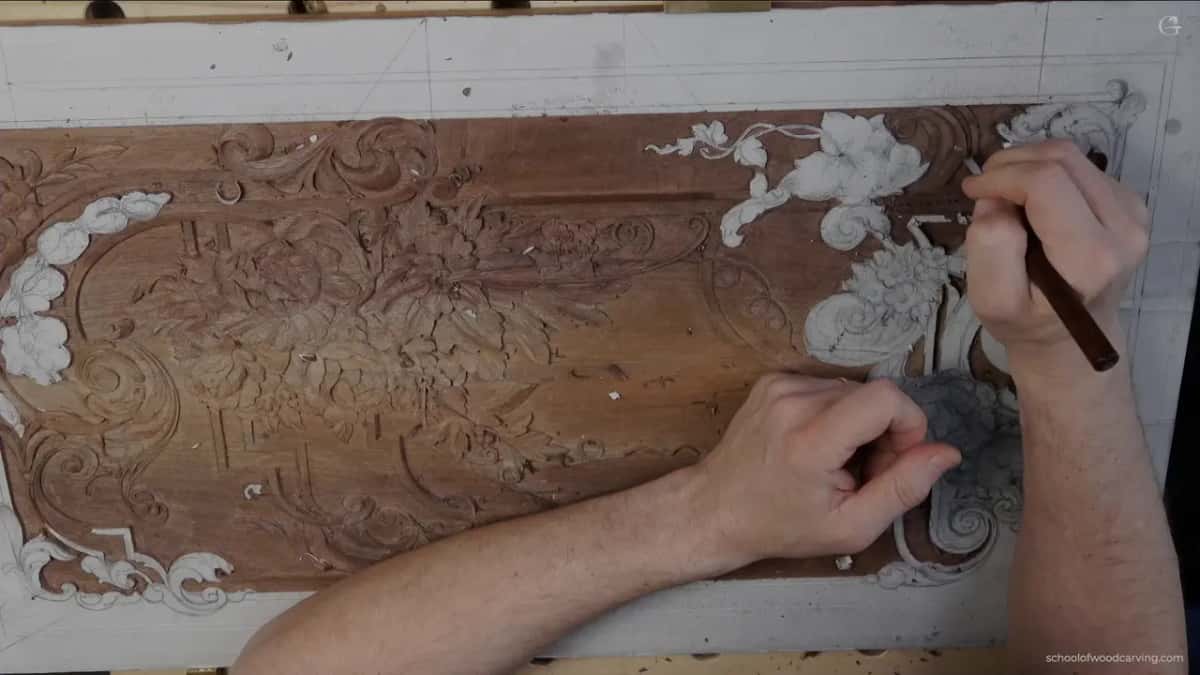 Both hands working the right hand end of the board.