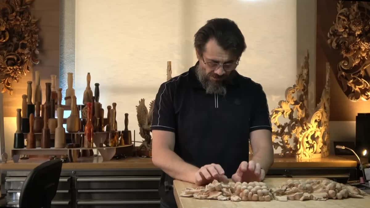 Working across the panel with both hands, the way you check a surface before deciding anything.