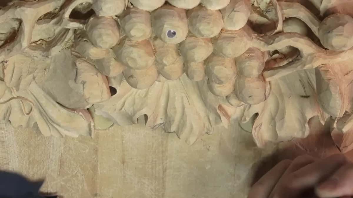 Carved grape cluster seen from above.