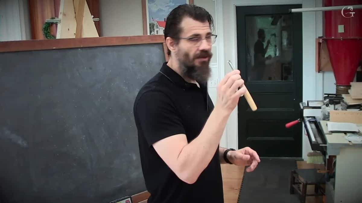 New gouge held up to the class, blade toward the camera