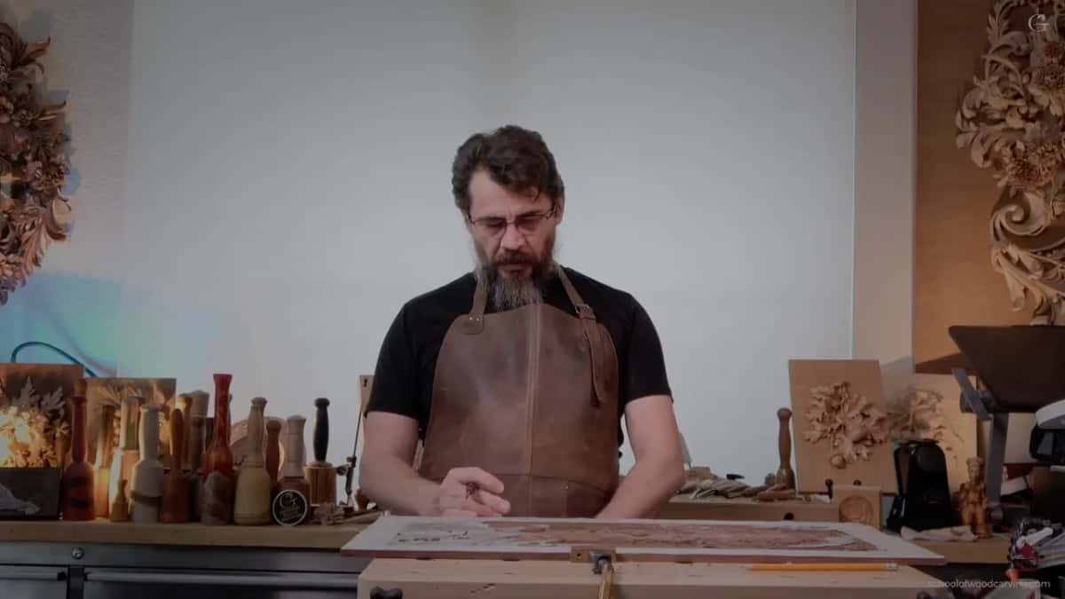 Hands resting on the panel between cuts.