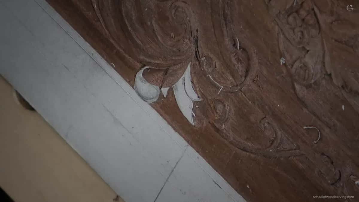 A shaving lying on the carved band where the eye is being raised.