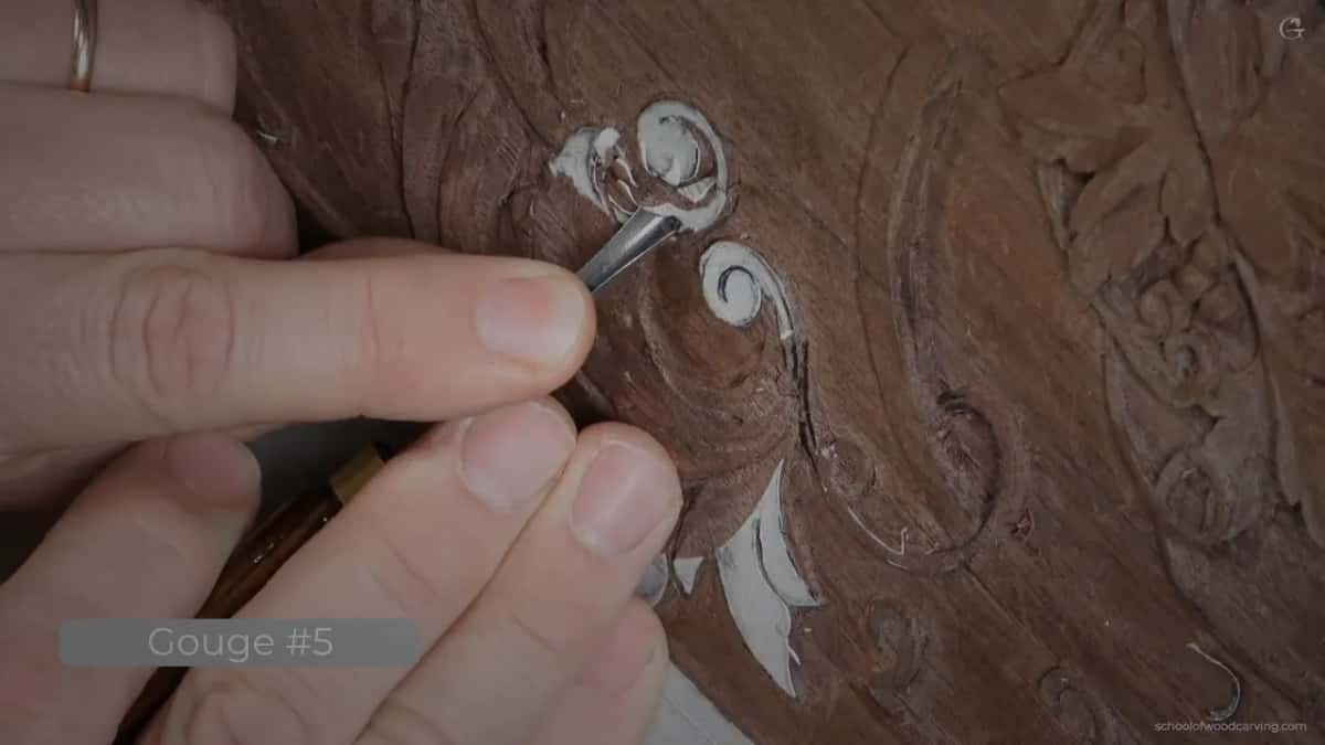 Gouge in the scroll, moving sideways.