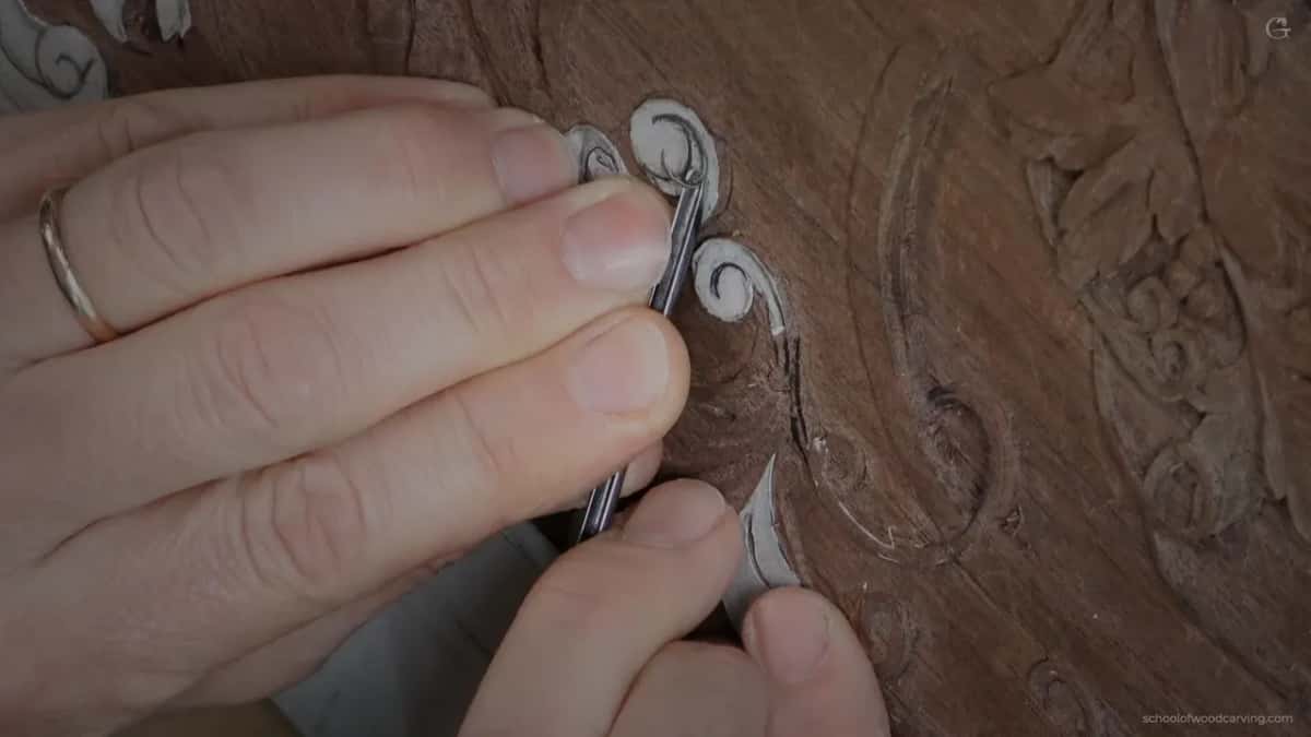Small tool pressed exactly where the two lines will meet, which is not the final mark.