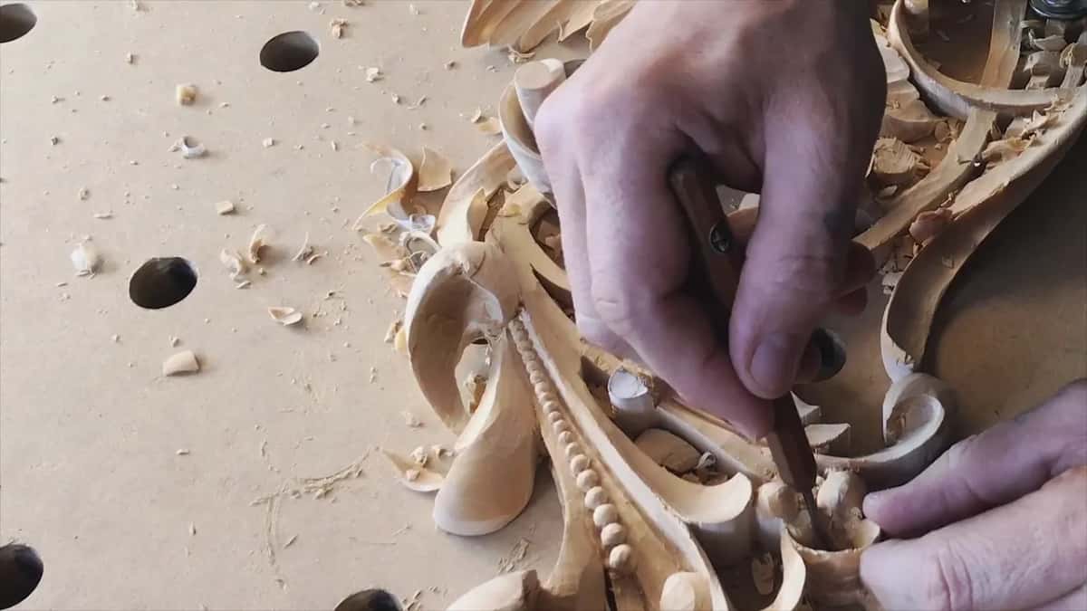 Fingers close in on the wall of an opening.