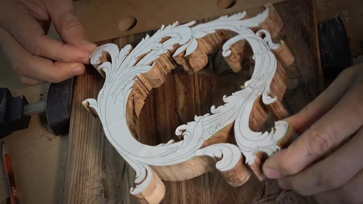 Olive wood for the second layer, its pattern still attached, going down onto the carved lid.
