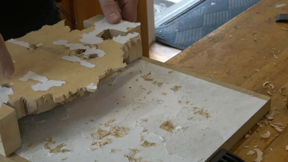 Panel face down, its openings showing the white board through them