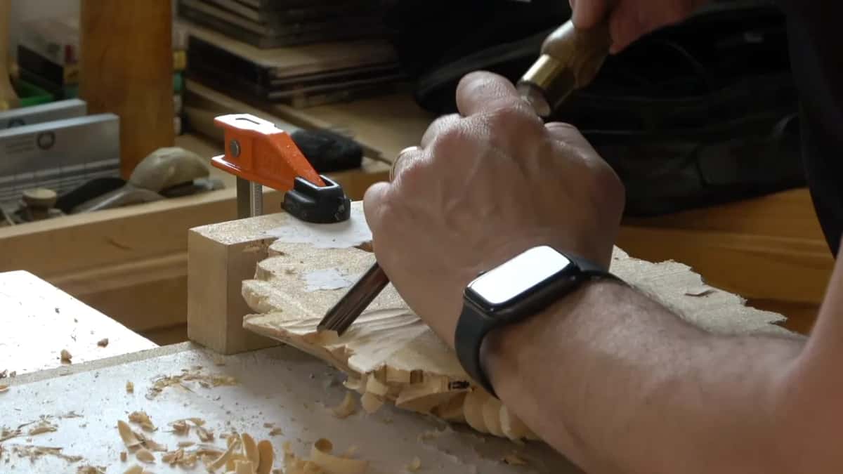 Brass ferruled gouge driven across the back, wrist braced hard against the board and shavings everywhere
