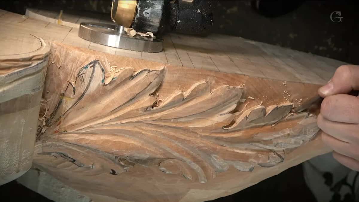 Fingers working between the last lobes at the far end