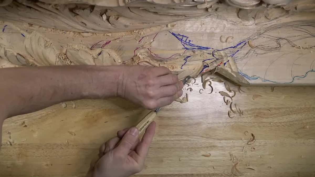 A gouge undercuts marked lines