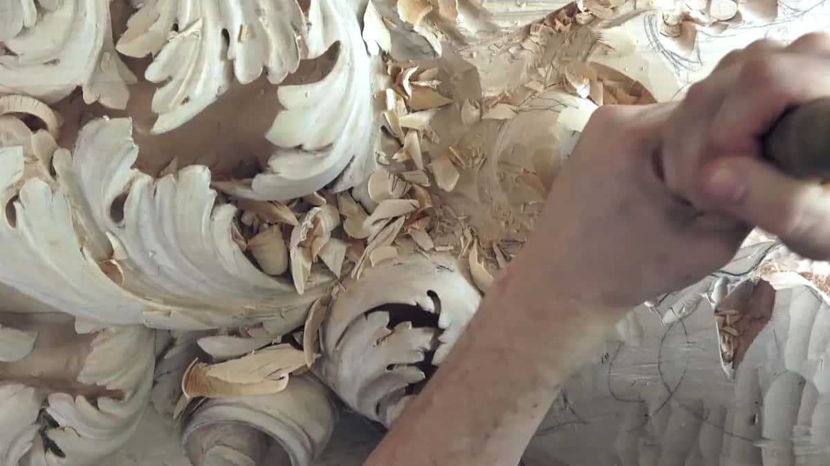 The big one, working His forearm bearing down on a big handle amid thick chips, a black hollow visible under one leaf below