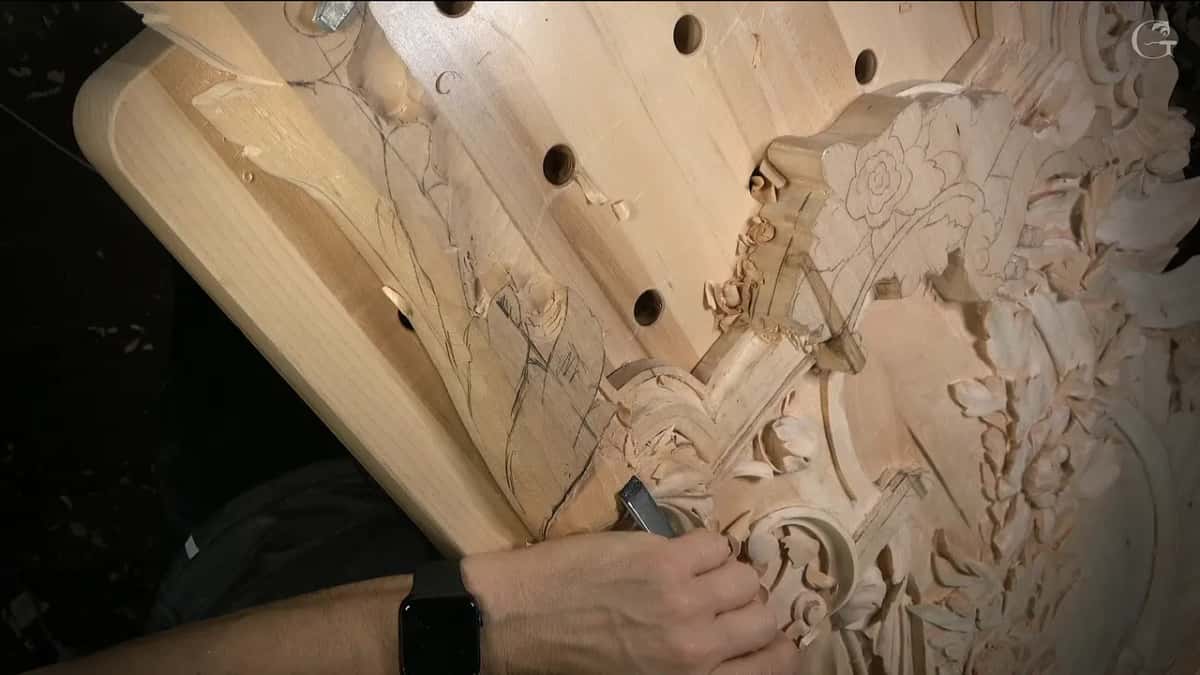 Chisel working in under a leaf right where the molding band begins