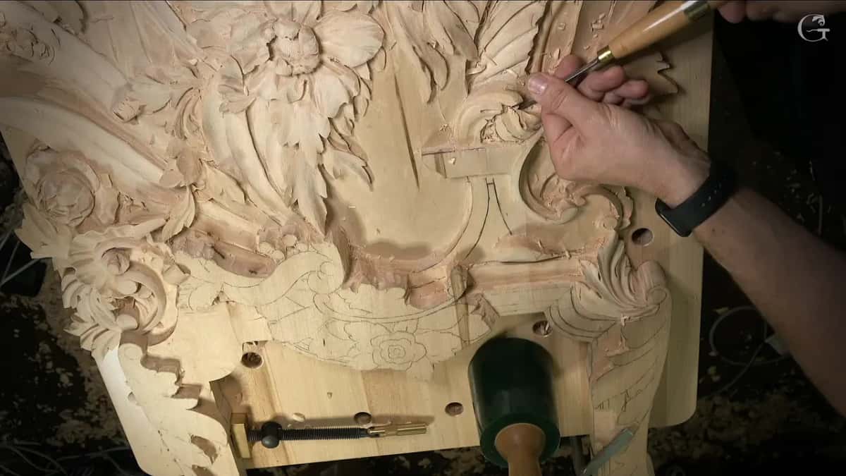 Brass ferruled tool at work next to a finished flower and leafage