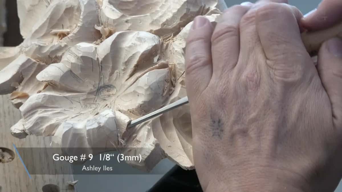Eighth inch deep gouge working a line beside a pencilled petal division