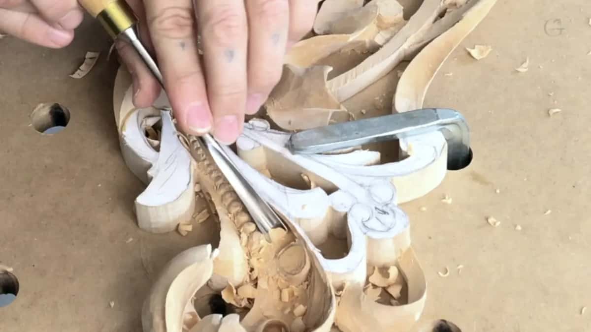 Pale handled tool held close in.