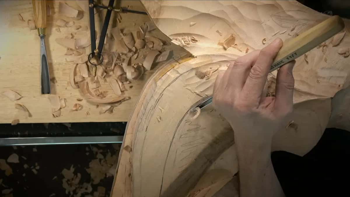Veiner in hand, working a narrow groove along the inside of the curve