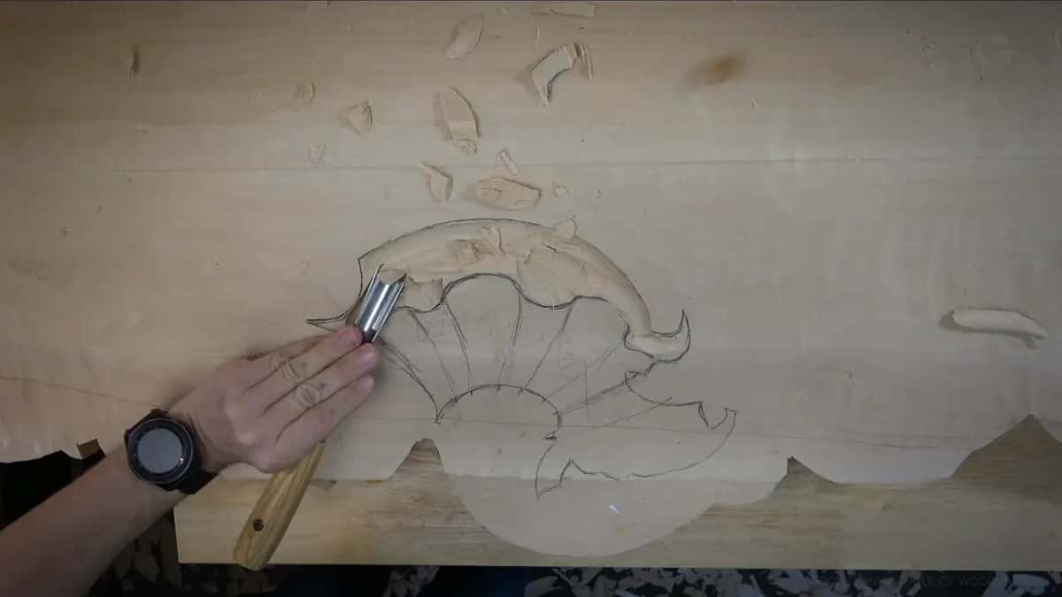 A long bevel Wrist watch on his arm beside the pencil line