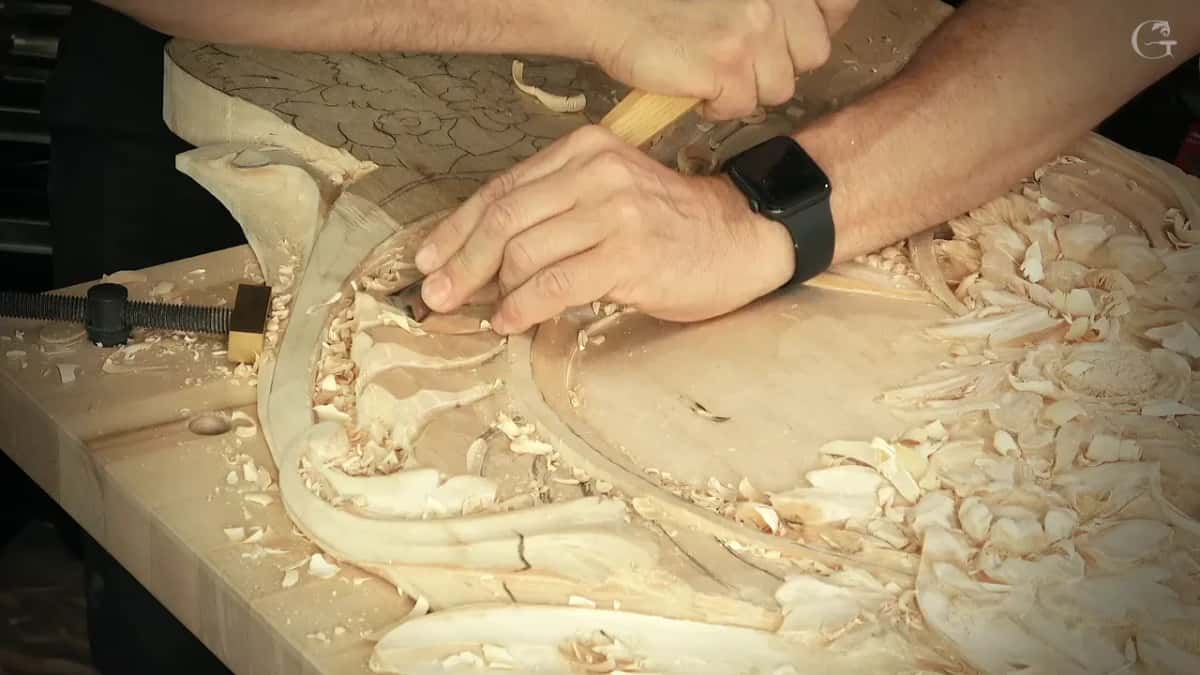 Beside the shell Hands low on the panel beside the shell