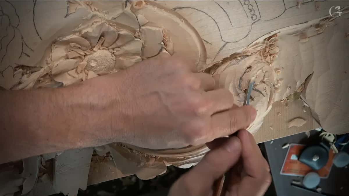 Forearm across the board, thin tool at the scroll