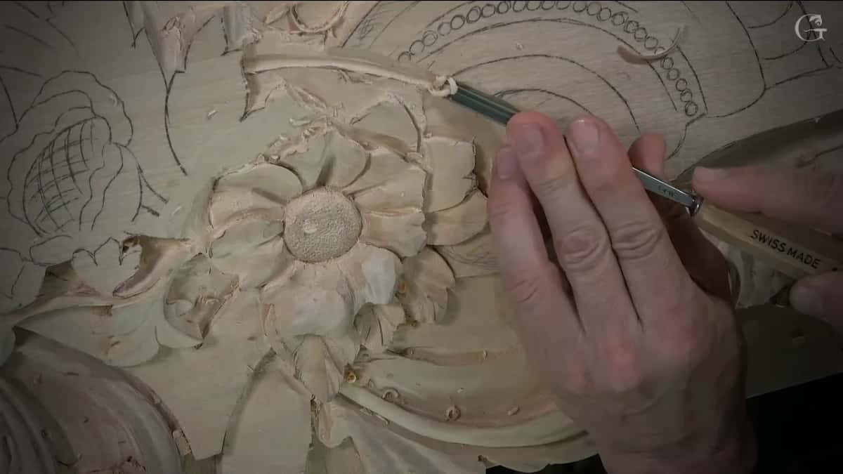 The veiner farther along that curved line, printing on its pale handle, the finished flower just below