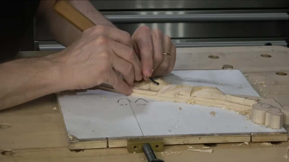 Small tool on the white board, going carefully at the ridges between hollows.