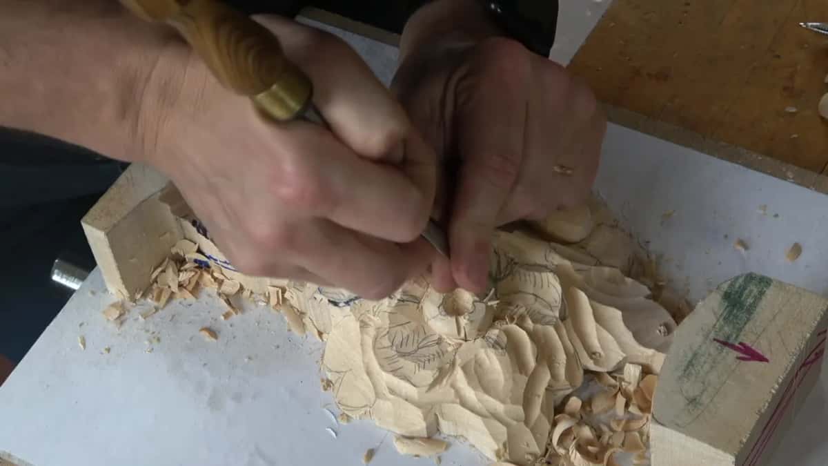 Flat chisel inverted, running the upper shape down onto the lower one